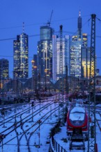 Railway tracks in front of the main railway station in Frankfurt am Main, skyline of skyscrapers in