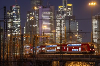 Railway tracks in front of the main railway station in Frankfurt am Main, skyline of skyscrapers in