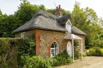 Small thatched cottage formerly Quilter estate property, Sutton, Suffolk, England, UK, Amy's