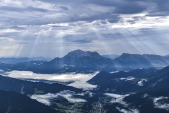 View from Edelweißlahner to the valley basin of Ramsau and Berchtesgaden with fog and sunbeams,