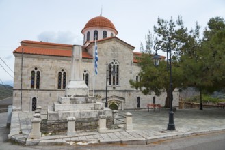 Church with red dome and traditional stone architecture under a mainly clear sky, Greek Orthodox,