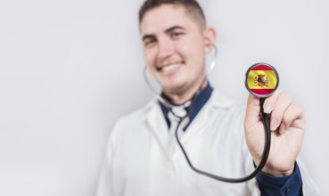 Smiling doctor holding stethoscope with Argentina flag isolated. Argentine Health and Care concept