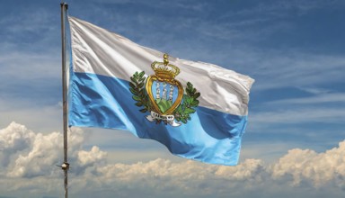 Flags, the national flag of San Marino flutters in the wind