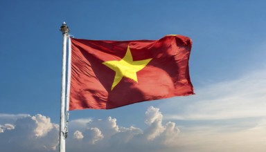 Flags, the national flag of Vietnam flutters in the wind