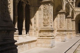 Old building with columns and arches decorated with architectural details in the inner courtyard at