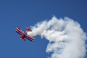 Aerobatic pilot at an air show with his biplane