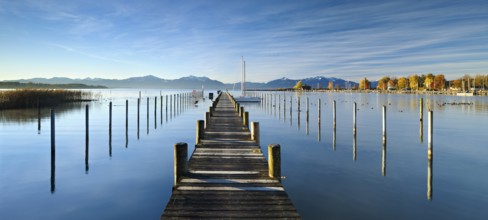 Jetty in the morning light, boat dock on Lake Chiemsee in autumn, Seebruck, Bavaria, Germany,