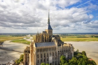 View from above of the historic monastery with clouds and a wide panorama, Le Mont-Saint-Michel