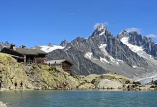 Lac Blanc mountain hut on the Lac Blanc mountain lake, behind the peaks Aiguille du Chardonnet and