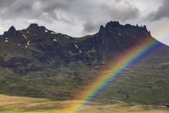 Rainbow and clouds over pointed mountains, farm in front, Berufjördur, East Fjords, Iceland, Europe