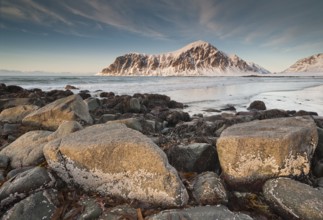 Winter evening mood at Skagsanden, rocks and beach near Flakstad, Flakstadøy, Lofoten, Nordland,