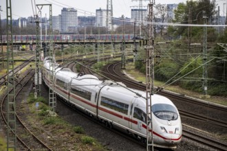 ICE train on the railway line between Mülheim an der Ruhr, in the background and Duisburg, busy