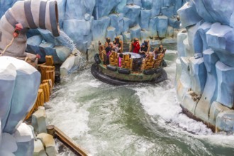 Park guests riding Popeye & Bluto's Bilge-Rat Barges in Toon Lagoon at Universal Studios Islands of