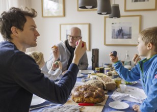 Family at Easter breakfast with Easter eggs, Bonn, 31.03.2024