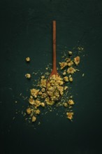 Chrysanthemum buds, tea, on a wooden boat, top view, no people