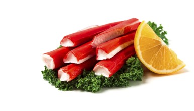 Fresh crab sticks, on Kale leaves, lemon slice, on a white background, horizontal, no people,