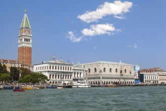 Venice's skyline with iconic bell tower and historic architecture on the canal, Venice, Italy,