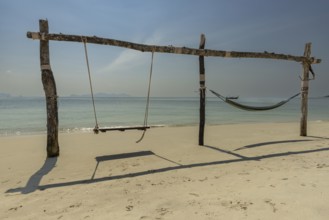 Swing and hammock on the beach of Koh Mook Island, Andaman Sea, Satun Province, Southern Thailand,