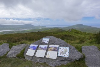 Signposts to the Skellig Rocks lying in the haze on the horizon, County Kerry, Republic of Ireland