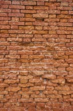 Detail of an old ziggurat wall made of bakestone bricks, Venice Italy