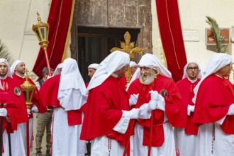 Confraternity of penitents gathering outside San Leonardo church, Enna, Siclly, Italy, Europe