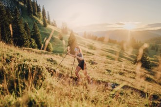 Summer trail running and hiking in the Alps on the Riedberg Pass between Obermaiselstein and