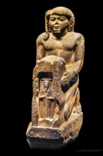 Statue of Chaemwaset holding a figure of Ptah from the exhibition: Ramses the Great and the Gold of