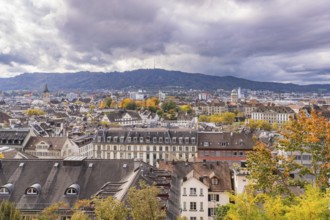 Panoramic view of city with lots of foliage colour and hilly landscape, Zurich, Switzerland, Europe