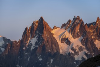 Rocky pointed mountain peaks at sunset, alpenglow, Aiguille du Plan, Mont Blanc massif, Chamonix,