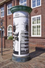 Advertising pillar with advertisement of the Stadeum at the Bahnhofstrasse in the city centre of