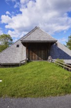 Driveway into a Black Forest house with an old wagon wheel of the Resenhof Farm Museum in the