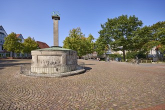 Brine spring on the Salzhof square under a blue, cloudless sky in the city centre of Bad Salzuflen,