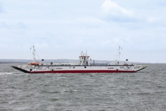 White ferry on a stormy sea under a cloudy sky, Killmer Ferry