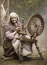 Irish peasant woman at the spinning wheel, County Galway, Ireland, Historical, digitally restored