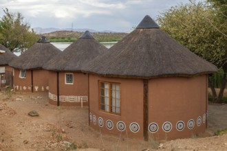 Colourful huts at the Goreangab Reservoir in Penduka Village near Windhoek, Namibia, Africa