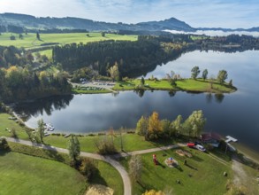 Sports facility and bathing area, lake Rottachsee, at village Petersthal, mt. Gruenten in the back,