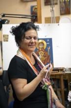 Greek icon paintress, 58 years old, in her studio, Mystras or Mistra, Laconia, Peloponnese, Greece,