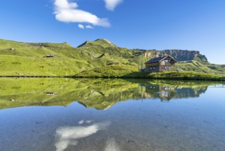 Hut at Fuscher Lacke, Edelweißspitz in the background, blue sky, reflection, Grossglockner High