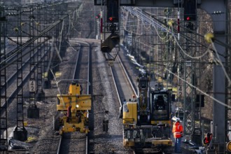 Labourers working with Liebherr A922 Rail Litronic and Kuhnle RR14 EVO 3 Rail two-way working