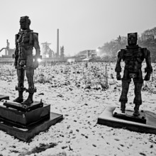 People made of iron, multi-part iron sculpture by Zbigniew Fraczkiewicz in front of the