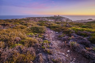 Cabo Espichel cape Espichel on Atlantic ocean at sunset with ruins