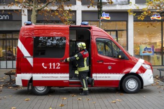 Vehicle with firefighter of the Erlangen fire brigade in the city centre, Erlangen, Middle