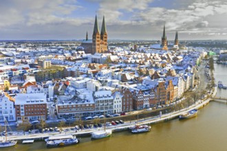 Aerial view over the river Trave and church towers in the old town of the Hanseatic City of Lübeck