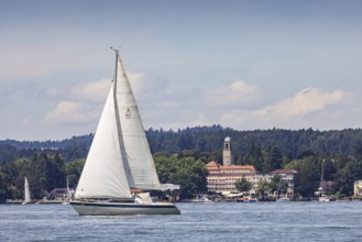 Sailing boat on Lake Constance in front of the luxury hotel Bad Schachen, Lindau, Lake Constance,