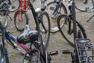 Large bicycle car park in front of the main railway station in, removed saddle, theft protection,