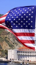 American star spangled flag waving in California. A large American flag is flying high above