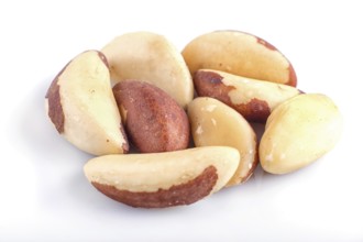 Pile of Brazil nuts isolated on white background. close up