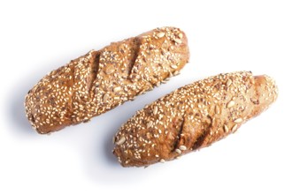 Rye bread with sunflower seeds, sesame and flax isolated on white. close up