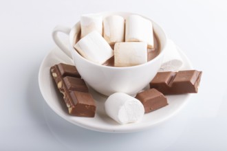 A cup of hot cocoa with marshmallow and milk chocolate isolated on white.isolated on white, closeup