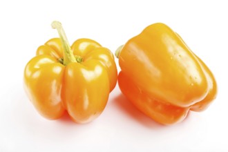 Two yellow sweet peppers isolated on white background. closeup